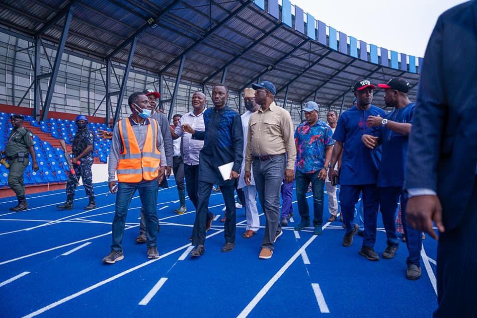 Governor Seyi Makinde and officials walk on a stadium track in an archival Oyo State photograph