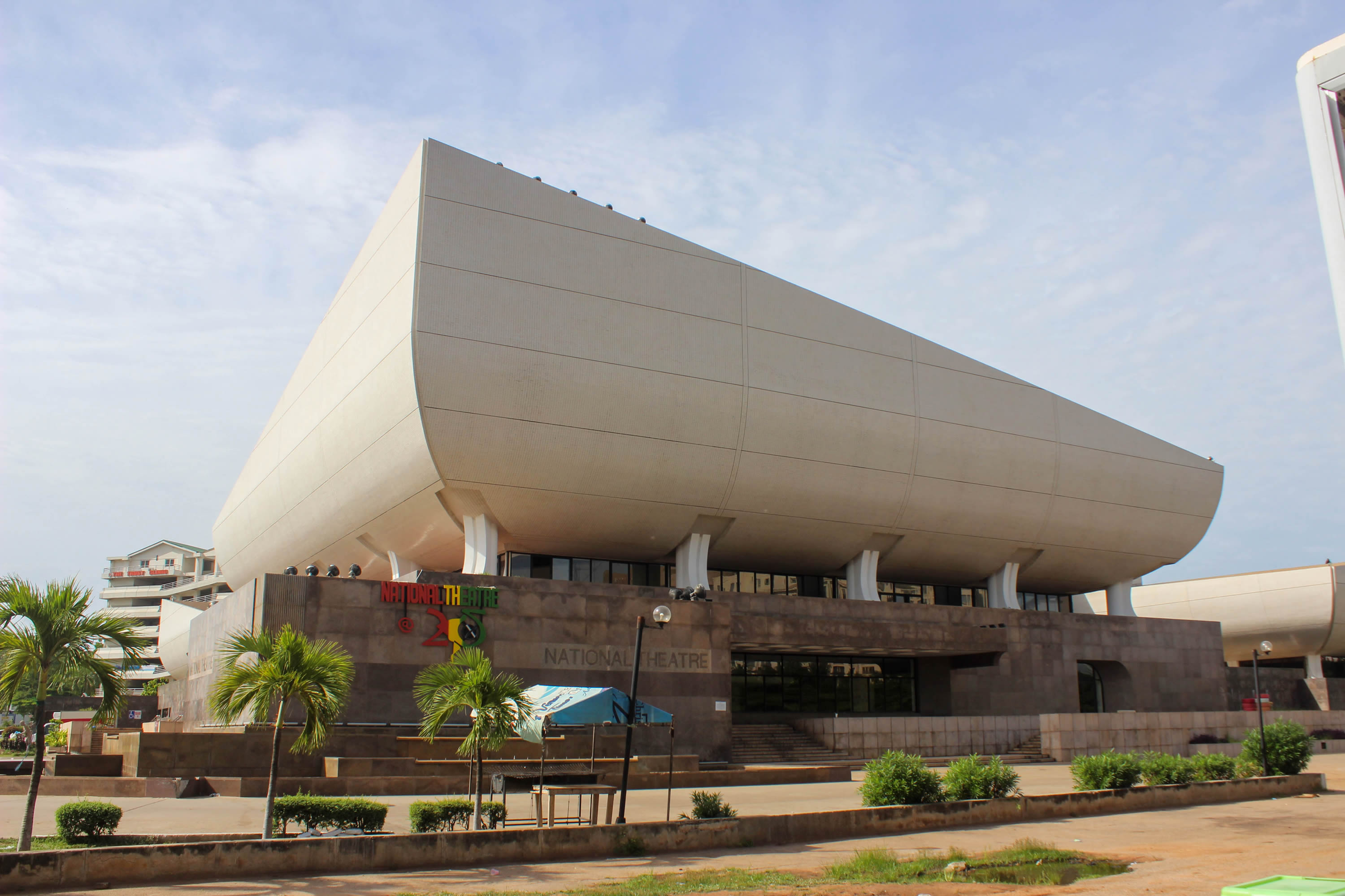 The curved white exterior of Ghana’s National Theatre in an archival daylight photograph