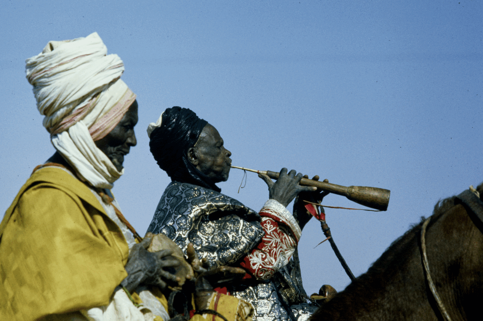 A trumpeter on horseback during a Sallah Durbar in Kano